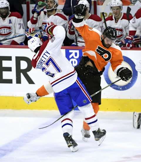 Jan 5, 2016; Philadelphia, PA, USA; Philadelphia Flyers defenseman Radko Gudas (3) checks Montreal Canadiens left wing Max Pacioretty (67) during the third period at Wells Fargo Center. The Flyers defeated the Canadiens, 4-3. Mandatory Credit: Eric Hartline-USA TODAY Sports