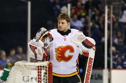 WINNIPEG, MB April 05: Calgary Flames goalie Jon Gillies (32) takes a water break during the NHL game between the Winnipeg Jets and the Calgary Flames on April 05, 2018 at the Bell MTS Place in Winnipeg MB. (Photo by Terrence Lee/Icon Sportswire via Getty Images)