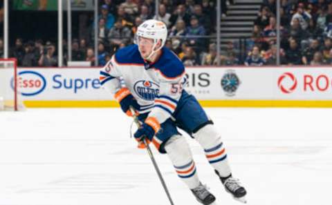 VANCOUVER, CANADA – JANUARY 21: Dylan Holloway #55 of the Edmonton Oilers skates with the puck during NHL action against the Vancouver Canucks on January, 21, 2023 at Rogers Arena in Vancouver, British Columbia, Canada. (Photo by Rich Lam/Getty Images)