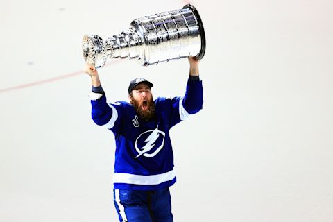 TAMPA, FLORIDA – JULY 07: David Savard #58 of the Tampa Bay Lightning hoists the Stanley Cup after the 1-0 victory against the Montreal Canadiens in Game Five to win the 2021 NHL Stanley Cup Final at Amalie Arena on July 07, 2021 in Tampa, Florida. (Photo by Mike Ehrmann/Getty Images)