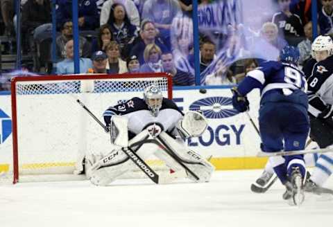 Feb 18, 2016; Tampa, FL, USA; Winnipeg Jets goalie Ondrej Pavelec (31) makes a save from Tampa Bay Lightning center Steven Stamkos (91) during the third period at Amalie Arena. Mandatory Credit: Kim Klement-USA TODAY Sports