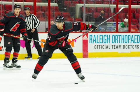 Jan 30, 2021; Raleigh, North Carolina, USA; Carolina Hurricanes right wing Nino Niederreiter (21) against the Dallas Stars at PNC Arena. Mandatory Credit: James Guillory-USA TODAY Sports