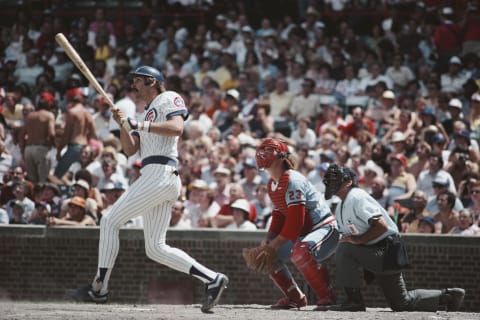 Dave Kingman, in fielder for the Chicago Cubs swings his bat at the plate as Ted Simmons, catcher for the Cardinals and home plate umpire Dutch Rennert look on during the Major League Baseball National League East game against the St. Louis Cardinals on 29 June 1980 at Wrigley Field, Chicago, United States. Cubs lost 9 – 7. (Photo by Jonathan Daniel/Allsport/Getty Images)