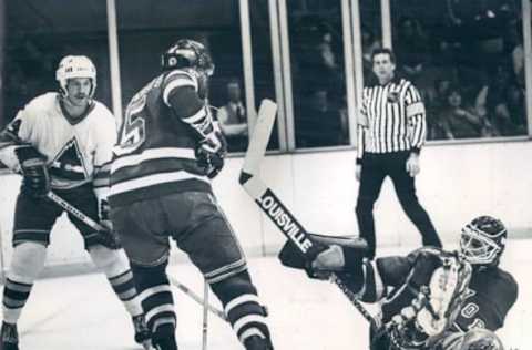 JAN 29 1981, JAN 30 1982 Ice Hockey – Colorado Rockies (Action) Rockies #14 Steve Tam Bellini ***** Rangers#5 Carol Vednais Defense Puck #41 Ed Mio goal soats Puck with 8 sec left in 2nd period Credit: Denver Post (Denver Post via Getty Images)