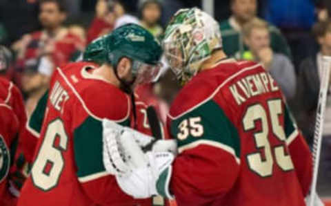 Dec 15, 2015; Saint Paul, MN, USA; Minnesota Wild forward Thomas Vanek (26) and goalie Darcy Kuemper (35) celebrate the win after the game against the Vancouver Canucks at Xcel Energy Center. The Minnesota Wild beat the Vancouver Canucks 6-2. Mandatory Credit: Brad Rempel-USA TODAY Sports