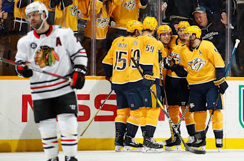 NASHVILLE, TN – DECEMBER 1: Eeli Tolvanen #11 of the Nashville Predators celebrates his goal with teammates against the Chicago Blackhawks at Bridgestone Arena on December 1, 2018 in Nashville, Tennessee. (Photo by John Russell/NHLI via Getty Images)