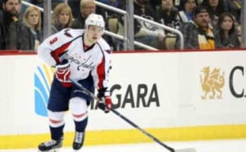 Mar 20, 2016; Pittsburgh, USA. Yet unsigned defenseman Dmitry Orlov faces off against the Penguins in a 6-2 loss. Mandatory Credit: Charles LeClaire-USA TODAY Sports