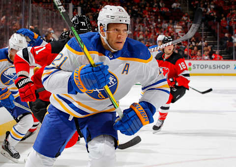 NEWARK, NEW JERSEY – OCTOBER 23: Kyle Okposo #21 of the Buffalo Sabres in action against the New Jersey Devils at Prudential Center on October 23, 2021 in Newark, New Jersey. The Devils defeated the Sabres 2-1 in overtime. (Photo by Jim McIsaac/Getty Images)