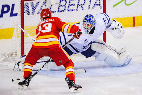 CALGARY, AB – JANUARY 26: Johnny Gaudreau #13 of the Calgary Flames scores against Frederik Andersen #31 of the Toronto Maple Leafs during an NHL game at Scotiabank Saddledome on January 26, 2021 in Calgary, Alberta, Canada. (Photo by Derek Leung/Getty Images)