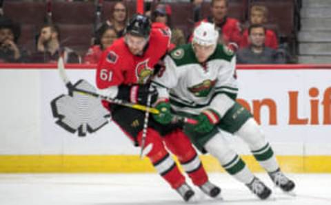 Nov 13, 2016; Ottawa, Ontario, CAN; Ottawa Senators right wing Mark Stone (61) and Minnesota Wild center Charlie Coyle (3) battle for the puck in the first period at Canadian Tire Centre. Mandatory Credit: Marc DesRosiers-USA TODAY Sports