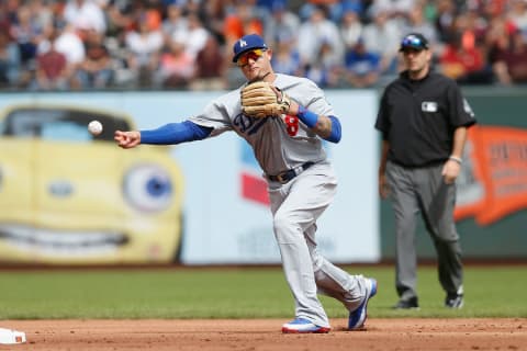 SAN FRANCISCO, CA – SEPTEMBER 29: Manny Machhado #8 of the Los Angeles Dodgers throws the ball to first base to get the out of Joe Panik #12 of the San Francisco Giants in the bottom of the first inning at AT&T Park on September 29, 2018 in San Francisco, California. (Photo by Lachlan Cunningham/Getty Images)