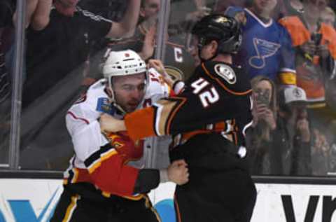 Apr 4, 2017; Anaheim, CA, USA; Calgary Flames defenseman Mark Giordano (5) and Anaheim Ducks defenseman Josh Manson (42) fight in the third period at Honda Center. The Ducks defeated the Flames 3-1. Mandatory Credit: Kirby Lee-USA TODAY Sports