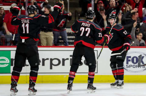 RALEIGH, NC – JANUARY 19: Carolina Hurricanes Center Jordan Staal (11), Carolina Hurricanes Defenceman Brett Pesce (22) and Carolina Hurricanes Left Wing Andrei Svechnikov (37) celebrate a first period goal during an NHL game between the Carolina Hurricanes and New York Islanders on January 19, 2020 at the PNC Arena in Raleigh, NC. (Photo by John McCreary/Icon Sportswire via Getty Images)