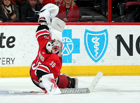 RALEIGH, NC – JANUARY 12: Cam Ward #30 of the Carolina Hurricanes deflects away a shot during the third period of an NHL game against the Washington Capitals on January 12, 2018 at PNC Arena in Raleigh, North Carolina. (Photo by Gregg Forwerck/NHLI via Getty Images)