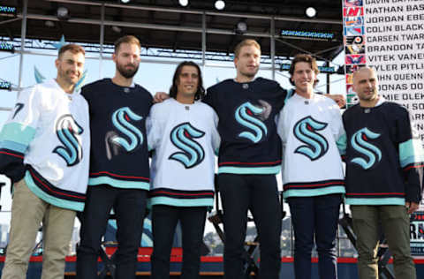 SEATTLE, WA – JULY 21: The Seattle Kracken draft picks (L-R) Jordan Eberle, Chris Driedger, Chris Tanev, Jamie Oleksiak, Haydn Fleury and Mark Giordano pose during 2021 NHL expansion draft at Gas Works Park on July 21, 2021 in Seattle, Washington. Thousands of free tickets were available to fans to attend this live broadcast event on ESPN2 to watch the Kraken make 30 selections to build their first roster in franchise history. (Photo by Karen Ducey/Getty Images)9