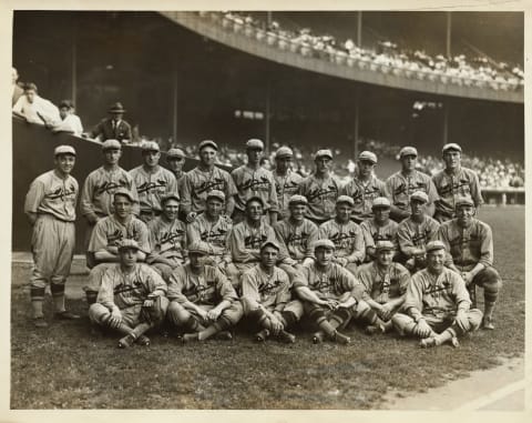 (Original Caption) The first photo to be made of the entire team of the St. Louis Nationals since they clinch the National League pennant. It was made at the Polo Grounds, and shows, left to right, first row: Billy Southworth, Thevenow, Keen, Vick, Bob O’Farrell, Grover Cleveland Alexander, manager. Second row, seated, Jim Bottomley, Bell, Haines, Williams, Hornsby, Killifer, Blades, Sherdel, Douthit. Rear row, Sothoron Holm, Hafey, no name, Reinhart, Warwick, no name, Topereer, Hallahan, Clough, Rhem. (Photo by George Rinhart/Corbis via Getty Images)