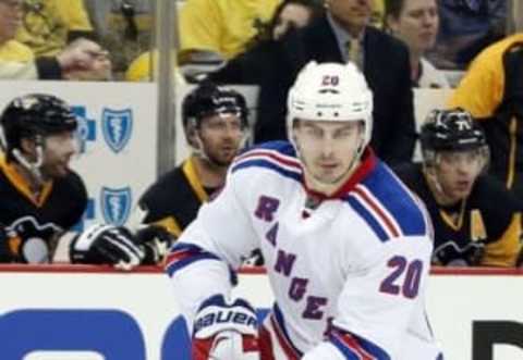 Apr 16, 2016; Pittsburgh, PA, USA; New York Rangers left wing Chris Kreider (20) skates with the puck against the Pittsburgh Penguins during the third period in game two of the first round of the 2016 Stanley Cup Playoffs at the CONSOL Energy Center. The Rangers won 4-2. Mandatory Credit: Charles LeClaire-USA TODAY Sports