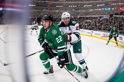 Jan 14, 2017; Dallas, TX, USA; Dallas Stars left wing Jiri Hudler (22) and Minnesota Wild defenseman Ryan Suter (20) chase the puck during the first period at the American Airlines Center. Mandatory Credit: Jerome Miron-USA TODAY Sports