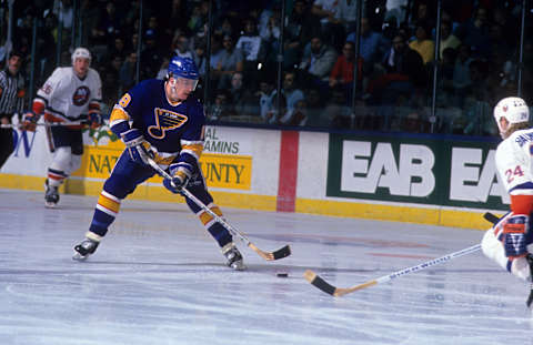 UNIONDALE, NY – DECEMBER 28: Rod Brind’Amour #19 of the St. Louis Blues skates with the puck during an NHL game against the New York Islanders on December 28, 1989 at the Nassau Coliseum in Uniondale, New York. (Photo by B Bennett/Getty Images)