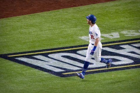 Oct 18, 2020; Arlington, Texas, USA; Los Angeles Dodgers center fielder Cody Bellinger (35) rounds the bases and celebrates hitting a home run against the Atlanta Braves during the seventh inning in game seven of the 2020 NLCS at Globe Life Field. Mandatory Credit: Jerome Miron-USA TODAY Sports