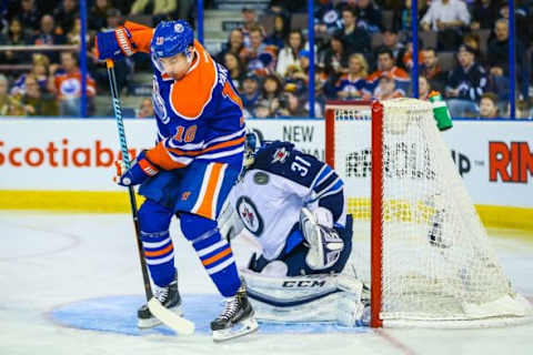 Feb 13, 2016; Edmonton, Alberta, CAN; Edmonton Oilers right wing Nail Yakupov (10) screens in front of Winnipeg Jets goalie Ondrej Pavelec (31) during the second period at Rexall Place. Mandatory Credit: Sergei Belski-USA TODAY Sports