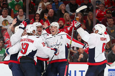 CHICAGO, IL – OCTOBER 20: Alex Ovechkin #8 of the Washington Capitals celebrates with teammates, including John Carlson #74, after scoring against the Chicago Blackhawks in the third period at the United Center on October 20, 2019 in Chicago, Illinois. (Photo by Chase Agnello-Dean/NHLI via Getty Images)