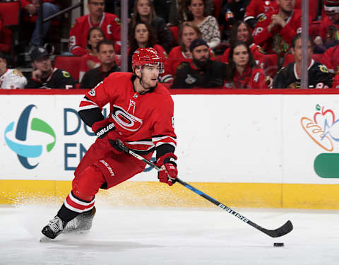 RALEIGH, NC – NOVEMBER 11: Noah Hanifin #5 of the Carolina Hurricanes controls the puck on the ice during an NHL game against the Chicago Blackhawks on November 11, 2017 at PNC Arena in Raleigh, North Carolina. (Photo by Gregg Forwerck/NHLI via Getty Images)