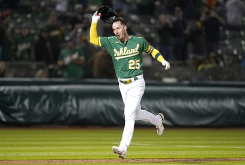 OAKLAND, CALIFORNIA – MAY 12: Brent Rooker #25 of the Oakland Athletics celebrates with teammates after he hit a walk-off fthree-run home run to defeat the Texas Rangers 9-7 in the bottom of the 10th inning at RingCentral Coliseum on May 12, 2023 in Oakland, California. (Photo by Thearon W. Henderson/Getty Images)