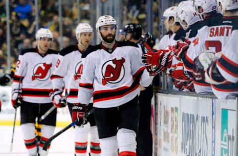 Mar 4, 2017; Boston, MA, USA; New Jersey Devils right wing Kyle Palmieri (21) is congratulated at the bench after scoring during the third period of the Boston Bruins 3-2 win over the New Jersey Devils at TD Garden. Mandatory Credit: Winslow Townson-USA TODAY Sports