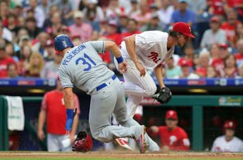 PHILADELPHIA, PA – JULY 24: Joc Pederson #31 of the Los Angeles Dodgers slides safely into home plate as Aaron Nola #27 of the Philadelphia Phillies applies the tag after throwing a wild pitch in the first inning during a game at Citizens Bank Park on July 24, 2018 in Philadelphia, Pennsylvania. (Photo by Hunter Martin/Getty Images)