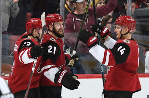 GLENDALE, AZ – JANUARY 18: Derek Stepan #21 of the Arizona Coyotes celebrates with teammates Vinnie Hinostroza #13 and Richard Panik #14 after scoring a goal against the Pittsburgh Penguins during the third period at Gila River Arena on January 18, 2019 in Glendale, Arizona. (Photo by Norm Hall/NHLI via Getty Images)