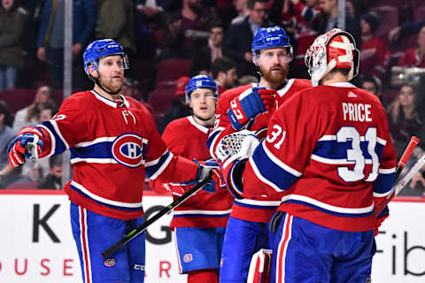 MONTREAL, QC – MARCH 26: Jeff Petry #26 and Karl Alzner #22 of the Montreal Canadiens congratulate goaltender Carey Price #31 for their victory against the Detroit Red Wings during the NHL game at the Bell Centre on March 26, 2018 in Montreal, Quebec, Canada. The Montreal Canadiens defeated the Detroit Red Wings 4-2. (Photo by Minas Panagiotakis/Getty Images)