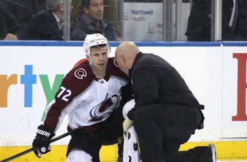 NEW YORK, NEW YORK – JANUARY 07: A trainer attends to Joonas Donskoi #72 of the Colorado Avalanche following a check from Ryan Lindgren #55 of the New York Rangers at Madison Square Garden on January 07, 2020 in New York City. The Rangers defeated the Avalanche 5-3. (Photo by Bruce Bennett/Getty Images)