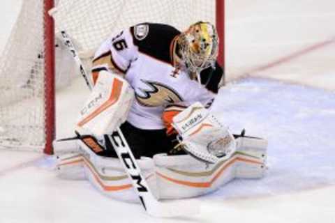 Mar 9, 2016; Denver, CO, USA; Anaheim Ducks goalie John Gibson (36) makes a glove save in the first period against the Colorado Avalanche at the Pepsi Center. Mandatory Credit: Ron Chenoy-USA TODAY Sports