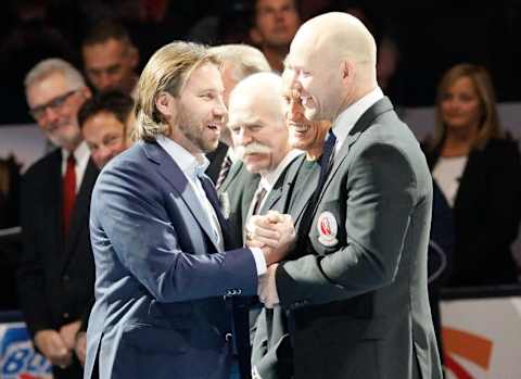 Nov 14, 2014; Hockey Hall of Fame inductee Peter Forsberg (left) is greeted by Hall of famers Mats Sundin (right) and Borje Salming and Lanny MacDonald. Mandatory Credit: John E. Sokolowski-USA TODAY Sports