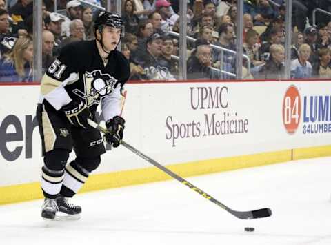 Feb 20, 2016; Pittsburgh, PA, USA; Pittsburgh Penguins defenseman Derrick Pouliot (51) handles the puck against the Tampa Bay Lightning during the first period at the CONSOL Energy Center. Tampa Bay won 4-2. Mandatory Credit: Charles LeClaire-USA TODAY Sports