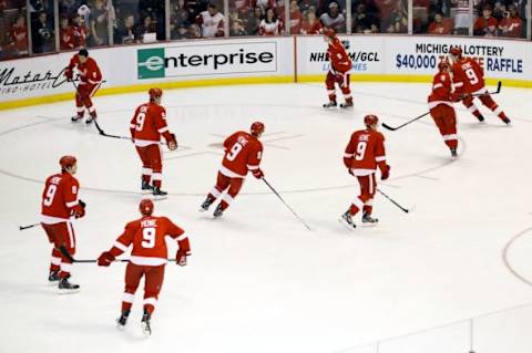 March 31, 2013; Detroit, MI, USA; Detroit Red Wings players warm up wearing jerseys of former Red Wings player Gordie Howe in honor of his 85th birthday before the game against the Chicago Blackhawks at Joe Louis Arena. Mandatory Credit: Rick Osentoski-USA TODAY Sports