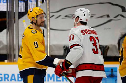 NASHVILLE, TENNESSEE – MAY 27: Filip Forsberg #9 of the Nashville Predators shakes hands with Andrei Svechnikov #37 of the Carolina Hurricanes after the Predators were eliminated from the playoffs in a 4-3 loss in Game Six of the First Round of the 2021 Stanley Cup Playoffs at Bridgestone Arena on May 27, 2021, in Nashville, Tennessee. (Photo by Frederick Breedon/Getty Images)