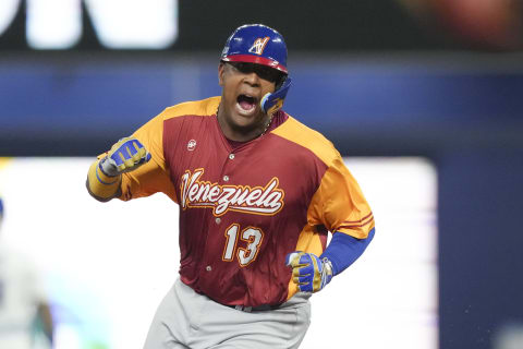 Salvador Perez of Venezuela celebrates while rounding the bases after Anthony Santander hit a three run home run in the first inning against Puerto Rico in Miami. (Photo by Eric Espada/Getty Images)