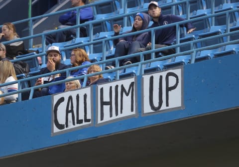 TORONTO, ON – SEPTEMBER 8: Fans in the upper deck hang a sign from the facing of the fifth deck calling for the promotion of Vladimir Guerrrero Jr. of the Buffalo Bisons to the Toronto Blue Jays during MLB game action against the Cleveland Indians at Rogers Centre on September 8, 2018 in Toronto, Canada. (Photo by Tom Szczerbowski/Getty Images)