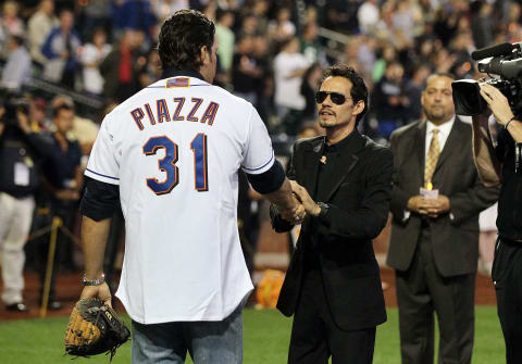 NEW YORK, NY – SEPTEMBER 11: Singer Marc Anthony greets former New York Met Mike Piazza during ceremonies honoring the tenth anniversary of the September 11 2001 terrorist attcks prior to the game between the Mets and Chicago Cubs at Citi Field on September 11, 2011 in the Flushing neighborhood of the Queens borough of New York City. (Photo by Jim McIsaac/Getty Images)