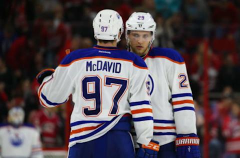 NHL Power Rankings: Edmonton Oilers forward Connor McDavid (97) talks to forward Leon Draisaitl (29) during the time out against the Carolina Hurricanes at PNC Arena. the Carolina Hurricanes defeated the Edmonton Oilers 2-1. Mandatory Credit: James Guillory-USA TODAY Sports