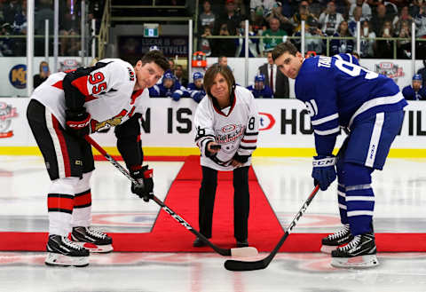 LUCAN, ON – SEPTEMBER 18: Organizing committee member Cathy Burghardt-Jesson Mayor of Lucan drops the puck for the ceremonial face-off with Matt Duchene #95 of the Ottawa Senators and John Tavares #91 of the Toronto Maple Leafs during Kraft Hockeyville Canada at the Lucan Community Memorial Centre on September 18, 2018 in Lucan, Ontario, Canada. (Photo by Dave Sandford/NHLI via Getty Images)