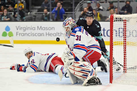 Oct 31, 2021; Seattle, Washington, USA; New York Rangers goaltender Igor Shesterkin (31) blocks a goal shot with his chest during the first period against the Seattle Kraken at Climate Pledge Arena. Mandatory Credit: Steven Bisig-USA TODAY Sports