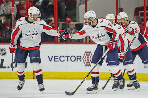 RALEIGH, NC – APRIL 22: Washington Capitals left wing Andre Burakovsky (65) congratulates Washington Capitals right wing Brett Connolly (10) after scoring in the first period during a game between the Carolina Hurricanes and the Washington Capitals on April 22, 2019 at the PNC Arena in Raleigh, NC. (Photo by Greg Thompson/Icon Sportswire via Getty Images)