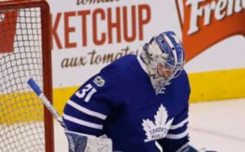 Mar 9, 2017; Toronto, Ontario, CAN; Toronto Maple Leafs goaltender Frederik Andersen (31) makes a glove save during the warm-up against the Philadelphia Flyers at the Air Canada Centre. Mandatory Credit: John E. Sokolowski-USA TODAY Sports