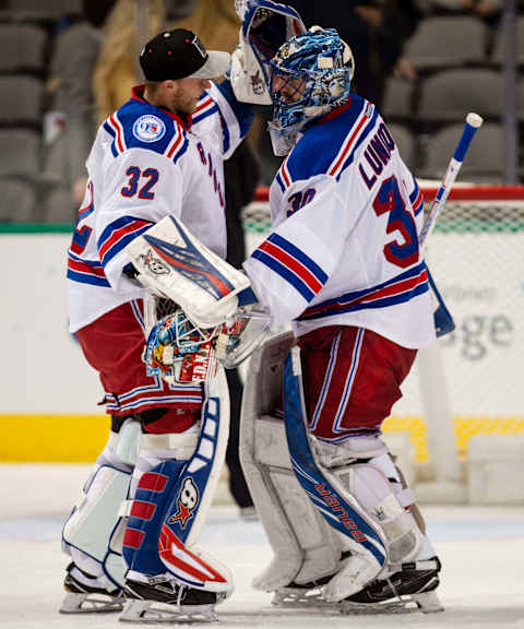 Dec 15, 2016; Dallas, TX, USA; New York Rangers goalie Antti Raanta (32) and goalie Henrik Lundqvist (30) celebrate the win over the Dallas Stars at the American Airlines Center. The Rangers shut out the Stars 2-0. Mandatory Credit: Jerome Miron-USA TODAY Sports.