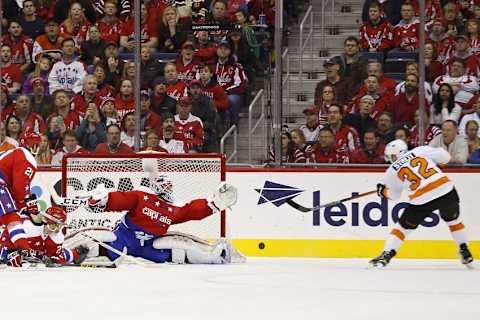 Feb 7, 2016; Washington, DC, USA; Washington Capitals goalie Braden Holtby (70) makes a save on Philadelphia Flyers defenseman Mark Streit (32) in the second period at Verizon Center. The Capitals won 3-2. Mandatory Credit: Geoff Burke-USA TODAY Sports