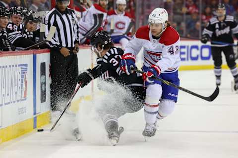 Apr 7, 2022; Newark, New Jersey, USA; New Jersey Devils center Pavel Zacha (37) plays the puck away from Montreal Canadiens defenseman Kale Clague (43) during the second period at Prudential Center. Mandatory Credit: Ed Mulholland-USA TODAY Sports