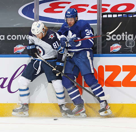 TORONTO, ON – JANUARY 18: Kyle Connor #81 of the Winnipeg Jets battles for the puck against Auston Matthews #34 of the Toronto Maple Leafs  . (Photo by Claus Andersen/Getty Images)